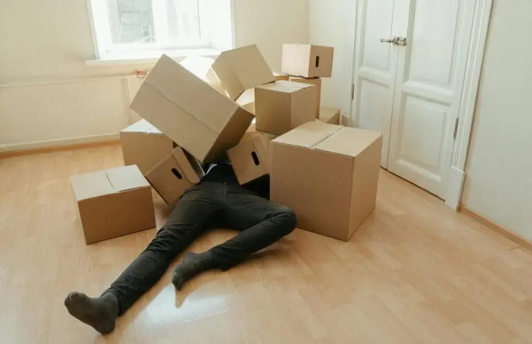 Man under pile of boxes
